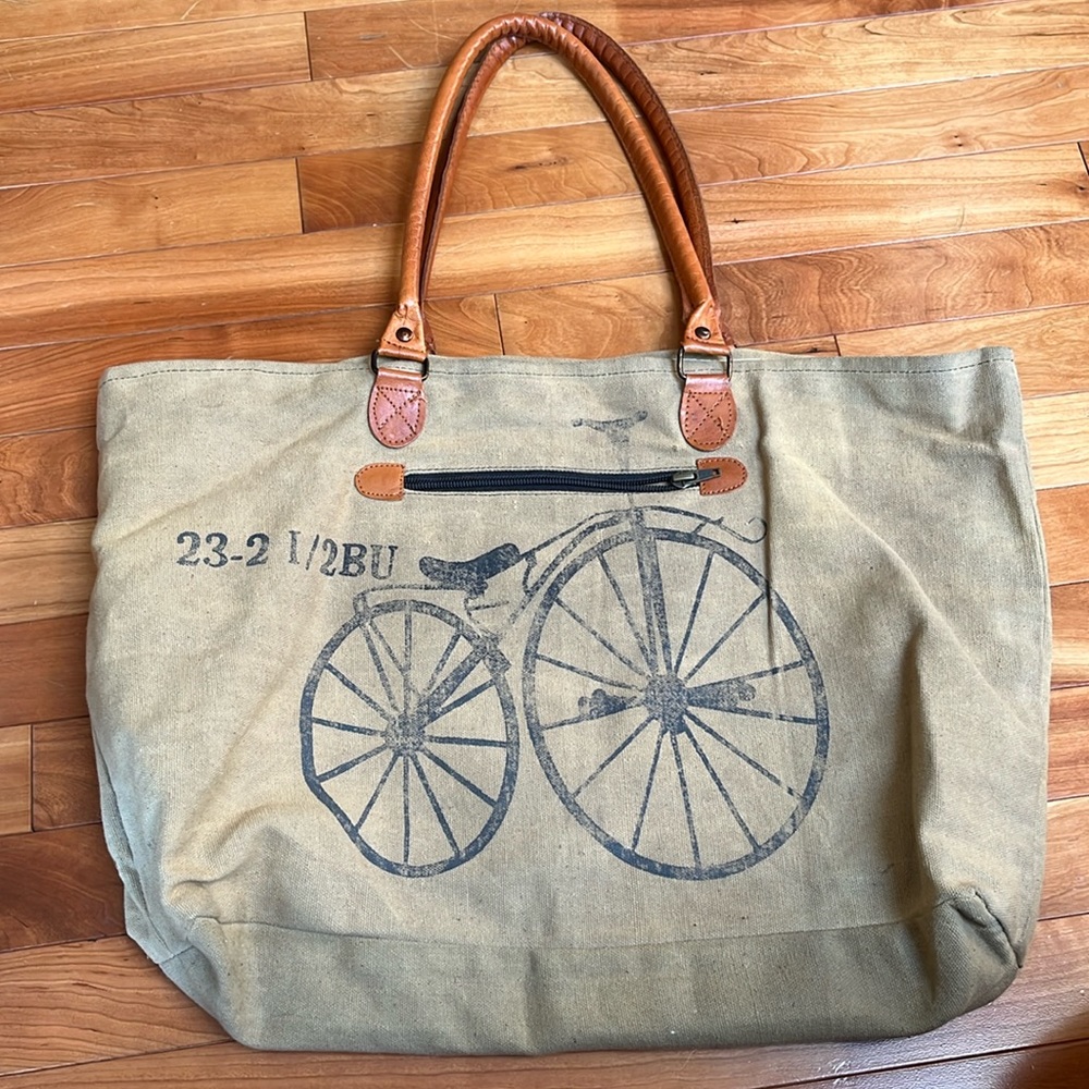 Mona B Tan Canvas Tote with Brown Leather Handles and Black Print
